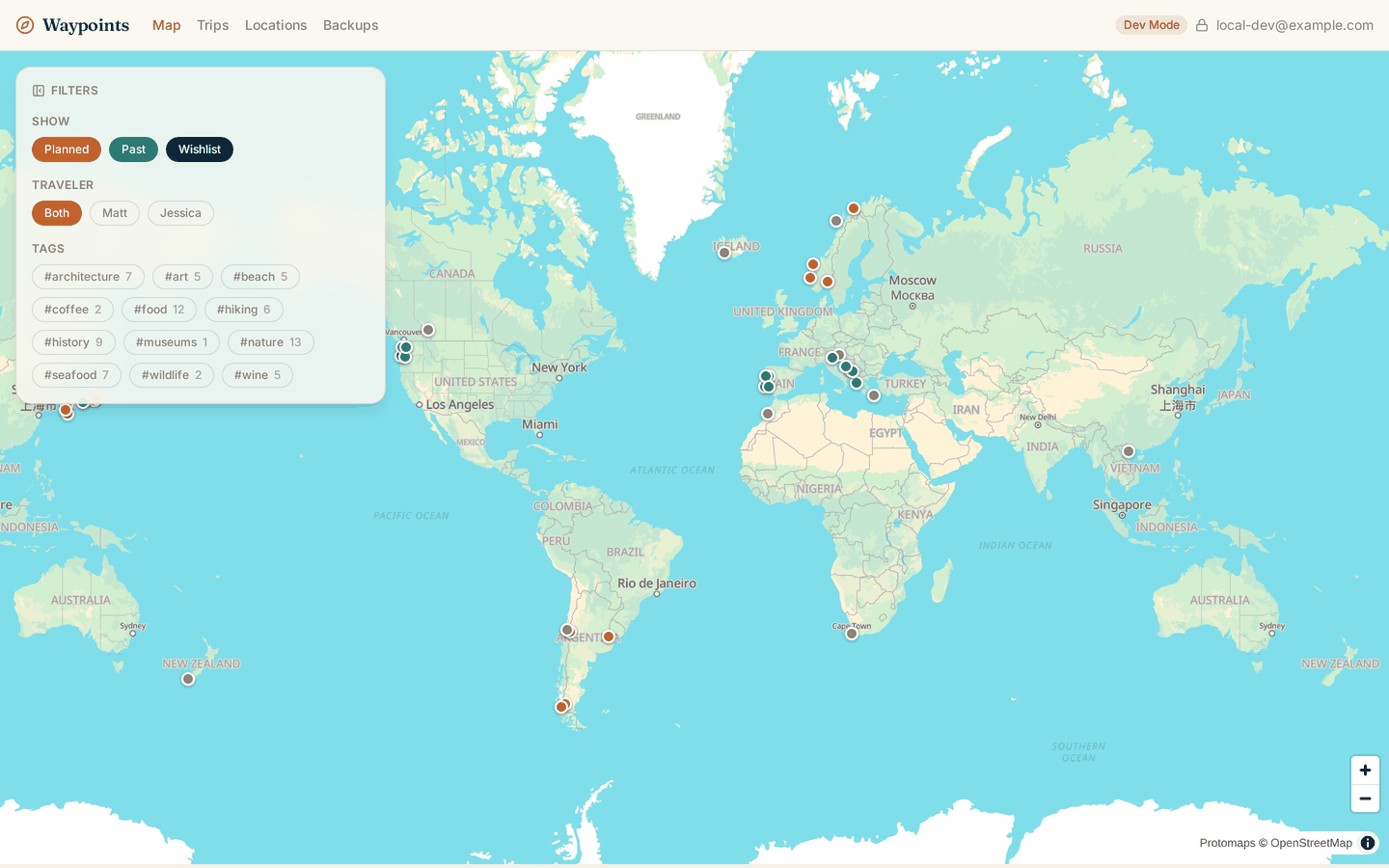 The map, with everything visible: planned trips in terracotta, past trips in teal, and unbooked wishlist locations in gray.